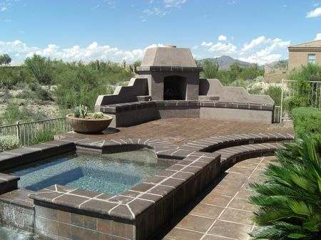 A nice untamed view of a wide open desert directly behind this backyard.