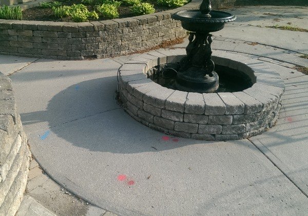 A nice water fountain provides the soothing sounds needed to relax on a patio.